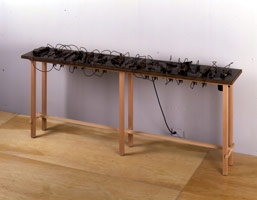 Peter Shelton / 
littlepipes, 1993 - 94 / 
bronze, water, copper, pump, & wood / 
38 1/2 x 93 1/2 x 16 in (97.8 x 237.5 x 40.6 cm)