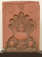 Unknown (India, Mughal) / 
      Stone Panel with Recessed Niche Containing Two Covered Bowls and a
      Larger Vase with Flowers, early 17th century / 
      red sandstone / 
      25 1/4 x 18 x 2 3/4 in. (64.1 x 45.7 x 7 cm)  / 
      Private collection / 
        / 
      These types of stone panels are called <em>chini
        khanas</em>,
      or China Rooms. This, together with the other stone panel in the show
      with a similar design, form a pair of wall niches from the same building.
      They are close in design to architectural elements still in situ
      on the Kanch Mahal (a palace of the Emperor Jahangir) dating from
      ca. 1605-1612, near Agra. 
