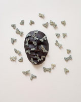 Alison Saar / 
Lunarseas: Sea of Serenity, 2008 / 
cast bronze, edition of five unique variations / 
Main element: 16 x 15 x 1 1/2 in (40.6 x 38.1 x 3.8 cm)