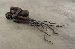Alison Saar / 
Bareroot, 2007 / 
wood, bronze, ceiling tin and tar / 
17 x 81 x 48 in (43.2 x 205.7 x 121.9 cm) / 
Private collection