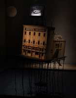 Michael C. McMillen / 
Lighthouse (Hotel New Empire), 2010  / 
      mixed media with artist digital motion picture  / 
      104 x 132 x 144 in. (264.2 x 335.3 x 365.8 cm)