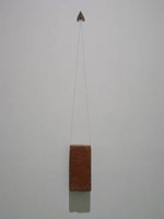 Michael C. McMillen / Moth and Brick (Vertical Landscape), 2006 / 
        Sphinx moth, brick and thread / 
        Installed dimensions: 34 x 4 x 3 in. (86.4 x 10.2 x 7.6 cm)