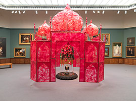 Rina Banerjee / 
Take me, take me, take me . . . to the Palace of love, 2003 / 
plastic, antique Anglo-Indian Bombay dark wood chair, steel and copper framework, floral picks, foam balls, cowrie shells, quilting pins, red-colored moss, antique stone globe, glass, synthetic fabric, shells, fake birds / 
226 x 161 x 161 in. (574 x 409 x 409 cm)