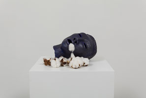 Alison Saar / 
Cotton Eater (head), 2013 / 
ceramic, acrylic, graphite, and cotton balls  / 
7 1/2 x 16 x 9 in. (19.1 x 40.6 x 22.9 cm)