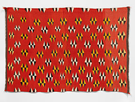 Unknown (Navajo) / 
Navajo Eye Dazzler Blanket, circa 1885 / 
Brown and white are natural, red, yellow orange, blue and gray are
synthetic dyed / 
78 x 54 3/4 in. (198.1 x 139.1 cm)