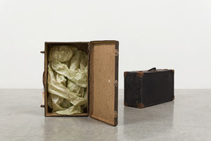 Alison Saar / 
Pret-a-Porter, 2013 / 
paper, matte medium, wax, pigment, and found suitcases / 
Suitcase 1 of 2: 26 x 15 x 8 in. (66 x 38.1 x 20.3 cm) / 
Suitcase 2 of 2: 28 x 14 x 9 in. (71.1 x 35.6 x 22.9 cm)