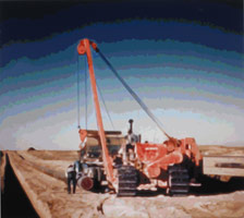 Timothy Tompkins / 
Translation - Laying Oil Pipe Near Kirku, 2007 / 
commercial sign enamel on aluminum  / 
60 x 67 in. (152.4 x 170.2 cm) / 
Private collection 