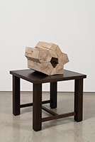 Richard Deacon / 
Fold in the Fabric 5, 2018 / 
Sculpture: wood (Holly and Cedar), epoxy / 
Table: fumed oak and MDF board / 
Sculpture: 12 1/4 x 13 3/4 x 11 in. (31 x 35 x 27.8 cm) / 
Table: 18 x 21 5/8 x 21 5/8 in. (45.5 x 55 x 55 cm)