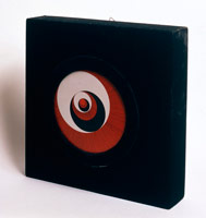 Marcel Duchamp / 
Rotoreliefs (Optical Disks), 1965 / 
Set of six cardboard disks, supplied with a suspension unit, a wooden box covered with black velvet, supporting a motor on the back which drives a revolving turntable / 
Disks printed on both sides in color offset lithography / 
To be viewed as they rotate at 33 1/3 revolutions per minute / 
Each Disk Dimensions: 7 7/8 in. (20 cm.) diameter / 
Box Dimensions: 14 3/4 x 14 3/4 x 3 5/16 in. (37.5 x 27.5 x 8.5 cm.)